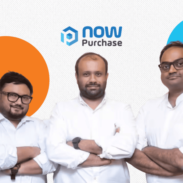 The core leadership team of NowPurchase, including founders Naman Shah and Aakash Shah and CTO Ankan Adhikari, standing side-by-side with folded arms. All three men are wearing white button-down shirts. They are positioned below the 'now Purchase' logo, set against a white background with a decorative orange circle on the left and a light blue circle on the right.